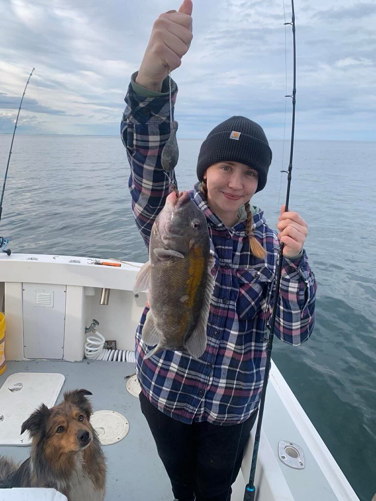 Angler holding a trophy blackfish on a fall charter