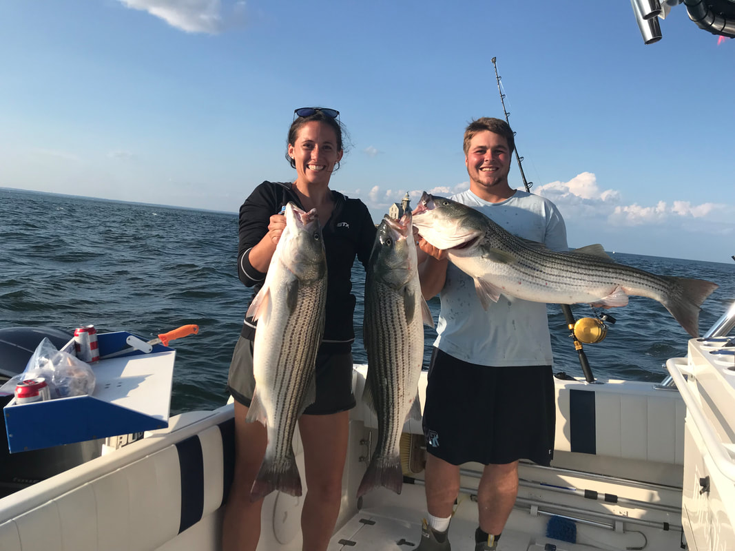 Two anglers doubled up on striped bass